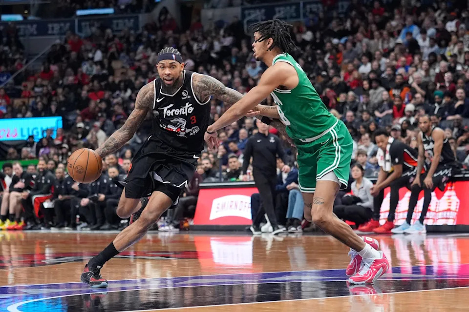 Dec 7, 2025; Toronto, Ontario, CAN; Toronto Raptors forward Brandon Ingram (3) tries to get past Boston Celtics forward Josh Minott (8) during the second half at Scotiabank Arena. Mandatory Credit: John E. Sokolowski-Imagn Images
