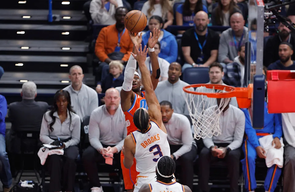 Dec 10, 2025; Oklahoma City, Oklahoma, USA; Oklahoma City Thunder guard Shai Gilgeous-Alexander (2) shoots as Phoenix Suns forward Dillon Brooks (3) defends during the first quarter at Paycom Center. Mandatory Credit: Alonzo Adams-Imagn Images