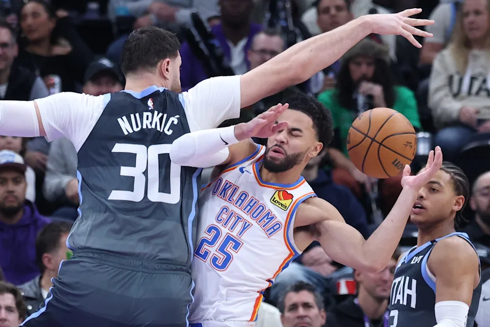 Dec 7, 2025; Salt Lake City, Utah, USA; Oklahoma City Thunder guard Ajay Mitchell (25) runs into Utah Jazz center Jusuf Nurkic (30) during a play in the second half at Delta Center. Mandatory Credit: Rob Gray-Imagn Images