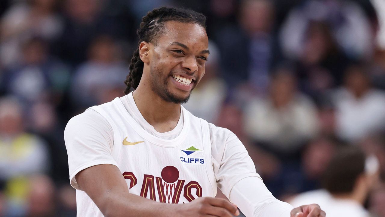 Cleveland Cavaliers guard Darius Garland reacts after a play against the Utah Jazz during the first half of an NBA basketball game, Sunday, March 23, 2025, in Salt Lake City. (AP Photo/Rob Gray)