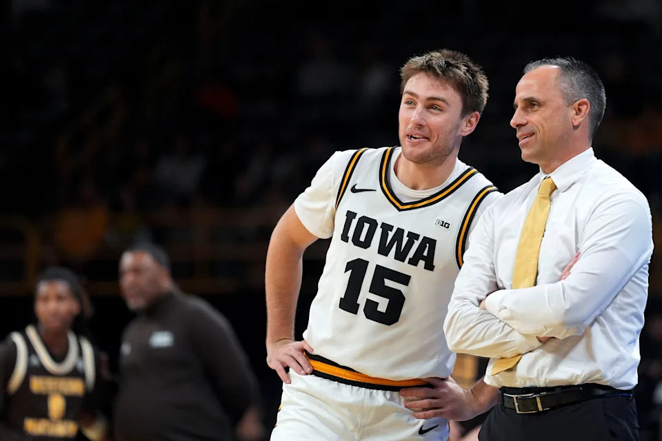 Iowa guard Brendan Hausen (15) talks to Iowa head coach Ben McCollum during a basketball game against the Western Michigan Broncos on Dec. 14, 2025, at Carver-Hawkeye Arena in Iowa City, Iowa.