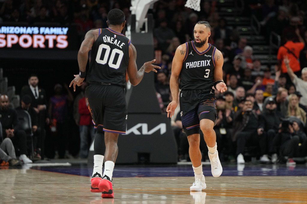Phoenix Suns forward Royce O'Neale (00) celebrates with forward Dillon Brooks (3)