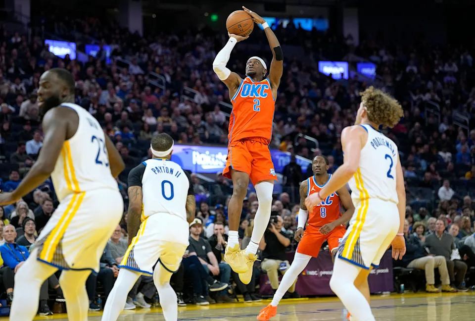 SAN FRANCISCO, CALIFORNIA - DECEMBER 02: Shai Gilgeous-Alexander #2 of the Oklahoma City Thunder shoots over Gary Payton II #0 of the Golden State Warriors in the second half at Chase Center on December 02, 2025 in San Francisco, California. NOTE TO USER: User expressly acknowledges and agrees that, by downloading and or using this photograph, User is consenting to the terms and conditions of the Getty Images License Agreement. (Photo by Thearon W. Henderson/Getty Images)