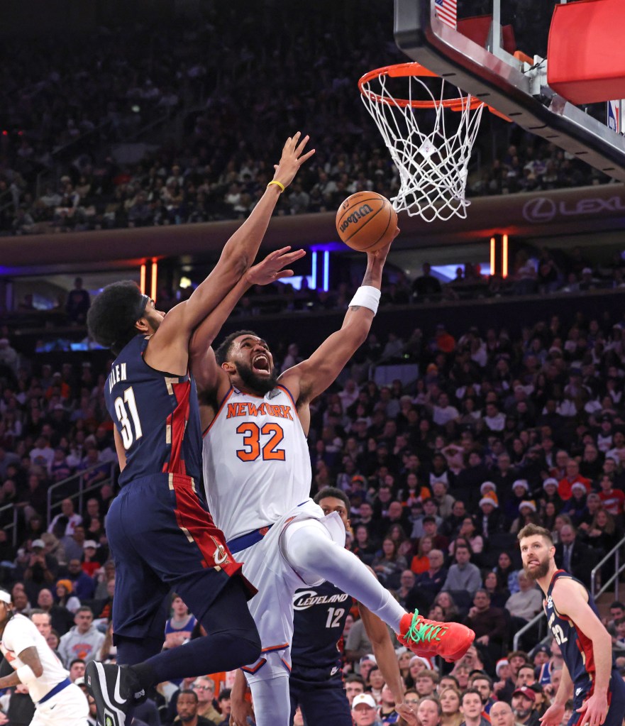 New York Knicks center Karl-Anthony Towns #32 goes up for shot as Cleveland Cavaliers center Jarrett Allen #31 jumps to defend during the second quarter.