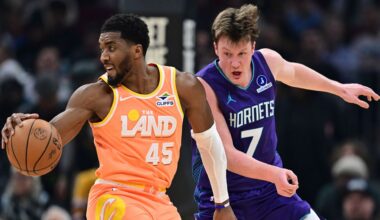 Cleveland Cavaliers guard Donovan Mitchell (45) spins around Charlotte Hornets guard Kon Knueppel (7) in the first half of an NBA basketball game, Monday, Dec. 22, 2025, in Cleveland. (AP Photo/David Dermer)
