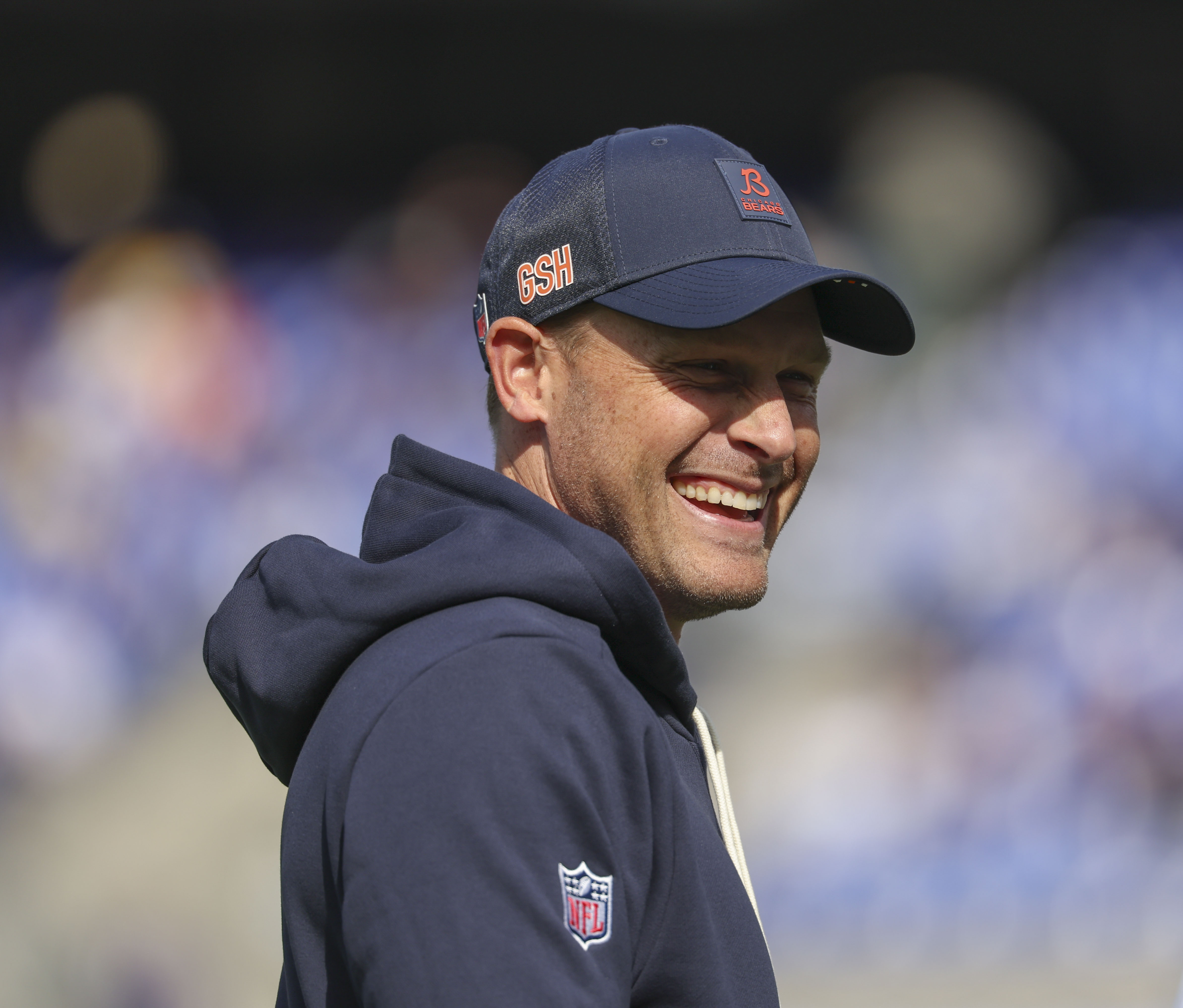 Bears coach Ben Johnson watches his team warm up to...