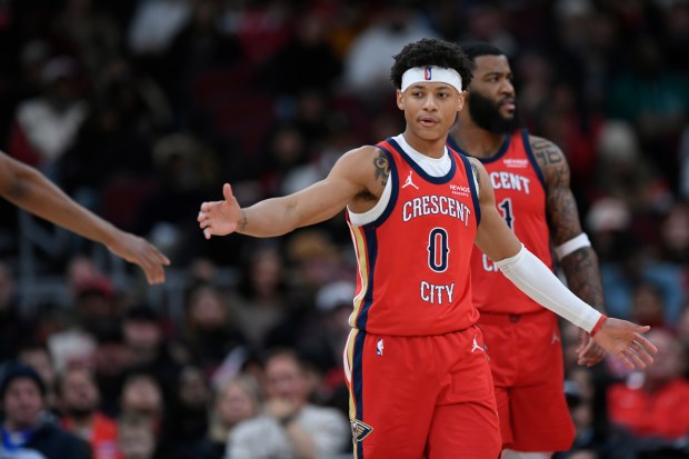 New Orleans Pelicans' Jeremiah Fears (0) celebrates with teammates during the second half of an NBA basketball game against the Chicago Bulls, Sunday, Dec. 14, 2025, in Chicago. (AP Photo/Paul Beaty)