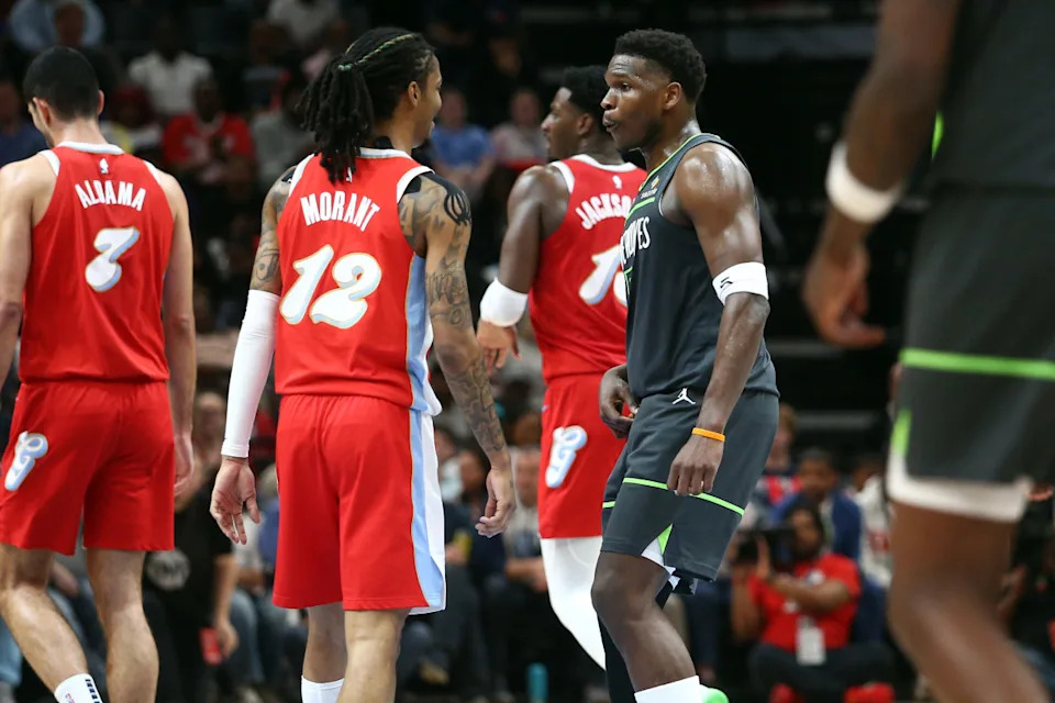 Minnesota Timberwolves guard Anthony Edwards (5) and Memphis Grizzlies guard Ja Morant (12).Credit&colon; Petre Thomas-Imagn Images
