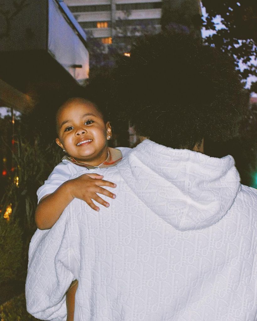 photo of cade cunningham holding daughter riley