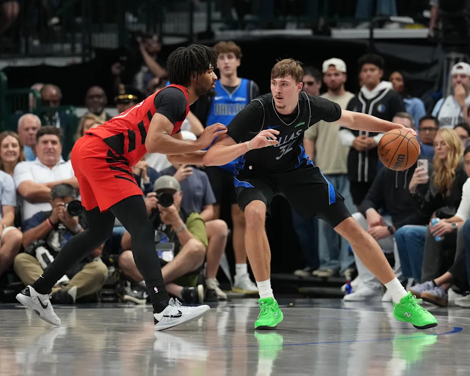 DALLAS, TX – NOVEMBER 16: Cooper Flagg #32 of the Dallas Mavericks handles the ball while defended by Shaedon Sharpe #17 of the Portland Trail Blazers during the game on November 16, 2025 at American Airlines Center in Dallas, Texas. NOTE TO USER: User expressly acknowledges and agrees that, by downloading and or using this photograph, User is consenting to the terms and conditions of the Getty Images License Agreement. Mandatory Copyright Notice: Copyright 2025 NBAE (Photo by Glenn James/NBAE via Getty Images)