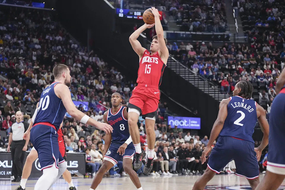 Apr 9, 2025; Inglewood, California, USA; Houston Rockets guard Reed Sheppard (15) shoots against Los Angeles Clippers center Ivica Zubac (40) in the second half at Intuit Dome. Mandatory Credit: Kirby Lee-Imagn Images