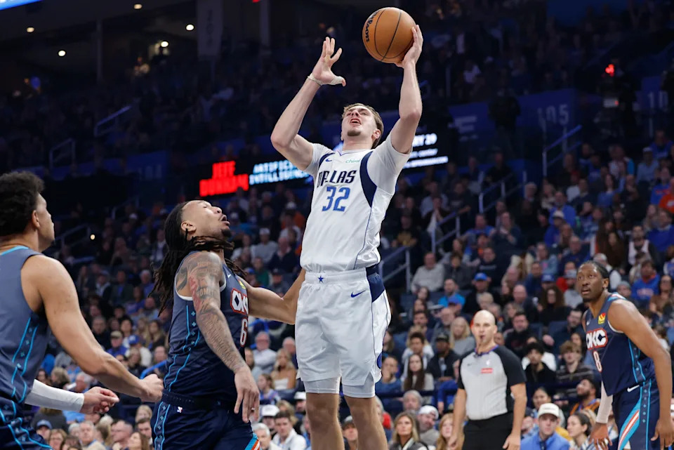 Dec 5, 2025; Oklahoma City, Oklahoma, USA; Dallas Mavericks forward Cooper Flagg (32) shoots beside Oklahoma City Thunder forward Jaylin Williams (6) during the second quarter at Paycom Center. Mandatory Credit: Alonzo Adams-Imagn Images