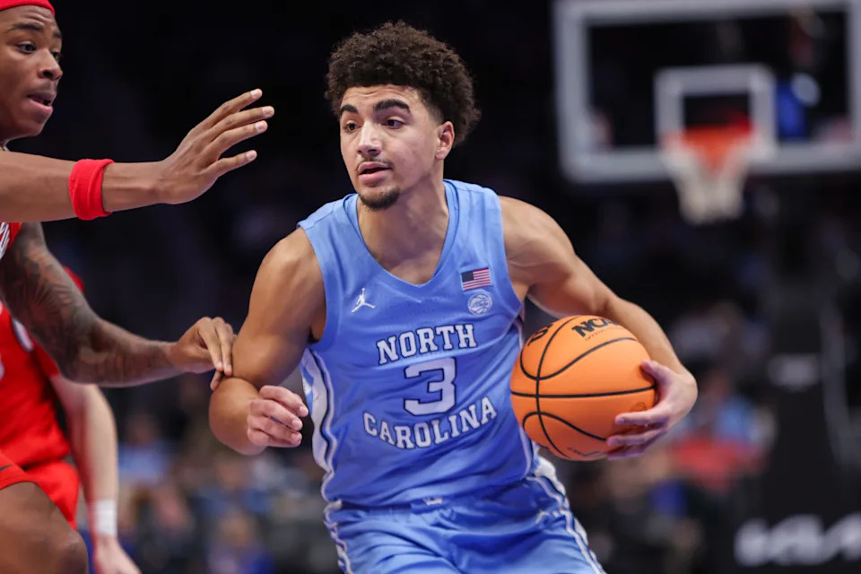Dec 20, 2025; Atlanta, Georgia, USA; North Carolina Tar Heels guard Derek Dixon (3) dribbles against the Ohio State Buckeyes in the second half at State Farm Arena. Mandatory Credit: Brett Davis-Imagn Images