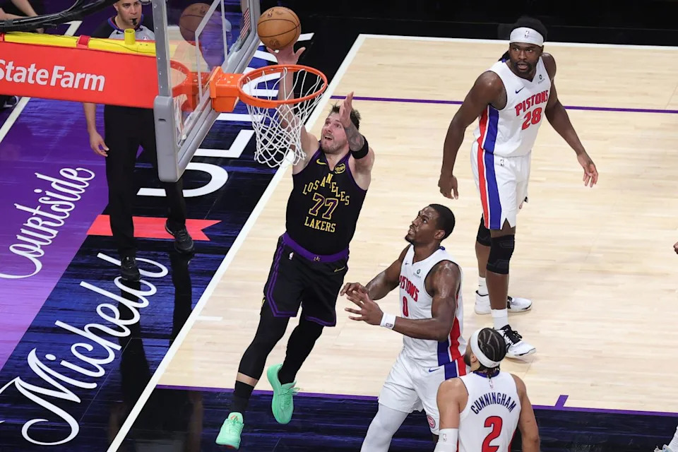 #77 PG Luka Doncic of the Los Angeles Lakers drives the lane during an NBA game against the Detroit Pistons on December 30, 2025 in Los Angeles, CA.