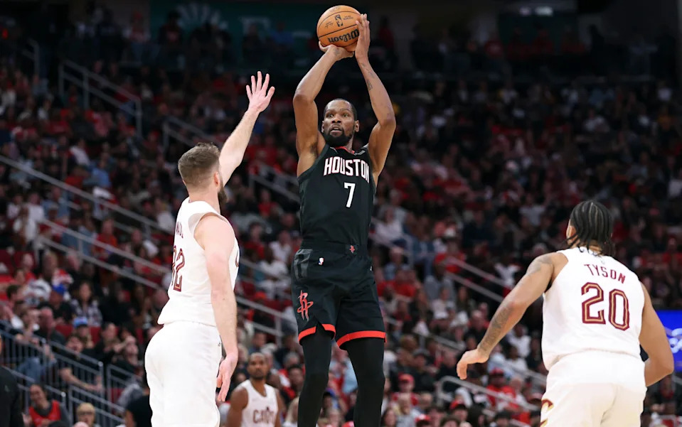 Rockets forward Kevin Durant shoots the ball over Cleveland Cavaliers forward Dean Wade in the third quarter, Dec. 27, 2025, in Houston.