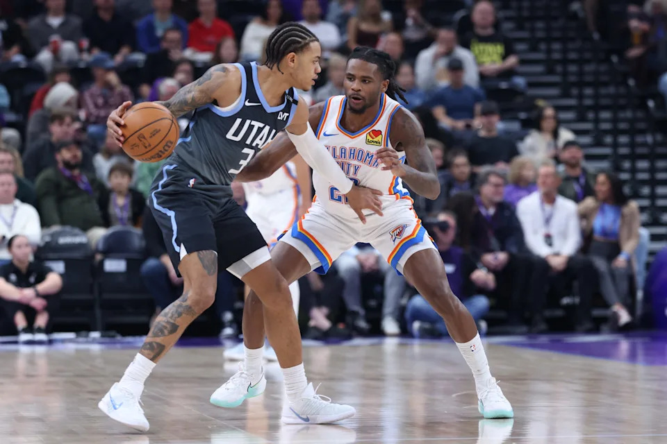 Dec 7, 2025; Salt Lake City, Utah, USA; Utah Jazz guard Keyonte George (3) dribbles the ball as Oklahoma City Thunder guard Cason Wallace (22) defends during the first quarter at Delta Center. Mandatory Credit: Rob Gray-Imagn Images