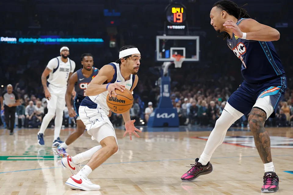 Dec 5, 2025; Oklahoma City, Oklahoma, USA; Dallas Mavericks guard Ryan Nembhard (9) drives to the basket against Oklahoma City Thunder forward Jaylin Williams (6) during the first quarter at Paycom Center. Mandatory Credit: Alonzo Adams-Imagn Images