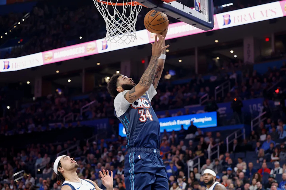 Dec 5, 2025; Oklahoma City, Oklahoma, USA; Oklahoma City Thunder guard Kenrich Williams (34) goes up for a basket against the Dallas Mavericks during the second half at Paycom Center. Mandatory Credit: Alonzo Adams-Imagn Images