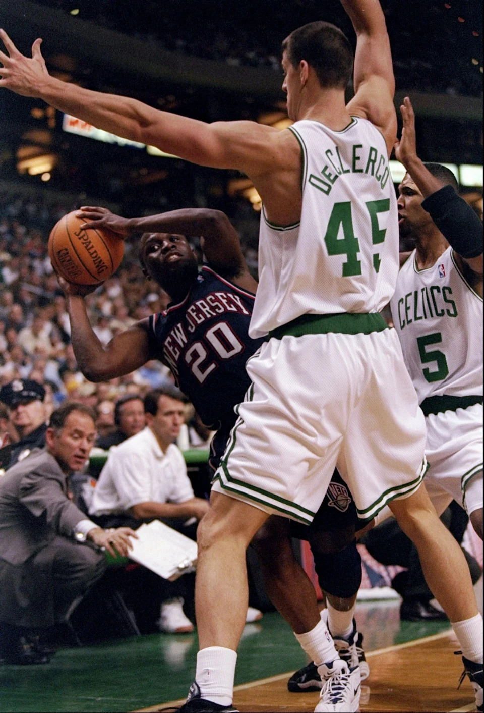 21 Nov 1997: Guard Sherman Douglas of the New Jersey Nets tries to get the ball past forward Andrew DeClercq (center) and guard Ron Mercer of the Boston Celtics during a game at the Fleet Center in Boston, Massachusetts. The Celtics won the game 101-93.