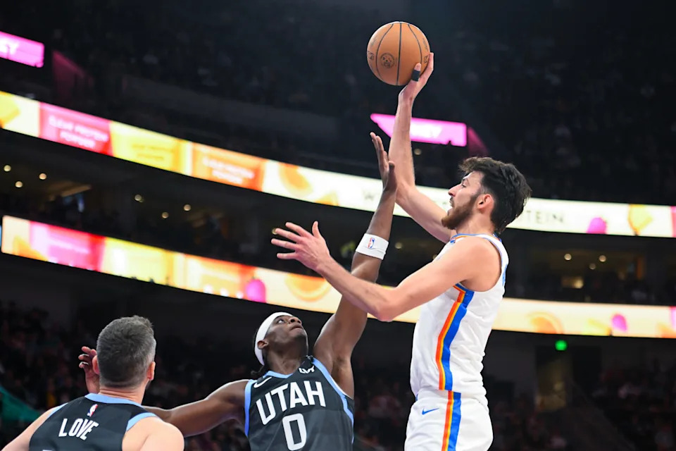 SALT LAKE CITY, UTAH - DECEMBER 07: Chet Holmgren #7 of the Oklahoma City Thunder shoots over Taylor Hendricks #0 of the Utah Jazz during the second half of a game at Delta Center on December 07, 2025 in Salt Lake City, Utah. NOTE TO USER: User expressly acknowledges and agrees that, by downloading and or using this photograph, User is consenting to the terms and conditions of the Getty Images License Agreement. (Photo by Alex Goodlett/Getty Images)