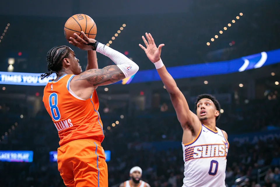 OKLAHOMA CITY, OKLAHOMA - DECEMBER 10: Jalen Williams #8 of the Oklahoma City Thunder shoots the ball against Ryan Dunn 30 of the Phoenix Suns during the first half of the Emirates NBA Cup - Quarterfinals game at Paycom Center on December 10, 2025 in Oklahoma City, Oklahoma. NOTE TO USER: User expressly acknowledges and agrees that, by downloading and or using this photograph, User is consenting to the terms and conditions of the Getty Images License Agreement. (Photo by William Purnell/Getty Images)