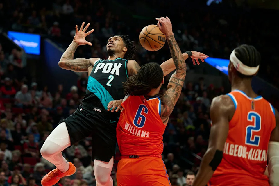 Nov 30, 2025; Portland, Oregon, USA; Portland Trail Blazers guard Caleb Love (2) loses control of the ball during the second half against Oklahoma City Thunder forward Jaylin Williams (6) at Moda Center. Mandatory Credit: Troy Wayrynen-Imagn Images