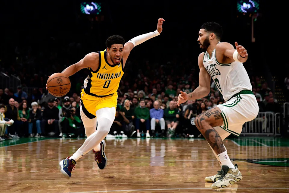 Dec 29, 2024; Boston, Massachusetts, USA; Indiana Pacers guard Tyrese Haliburton (0) controls the ball while Boston Celtics forward Jayson Tatum (0) defends during the second half at TD Garden. Mandatory Credit: Bob DeChiara-Imagn Images