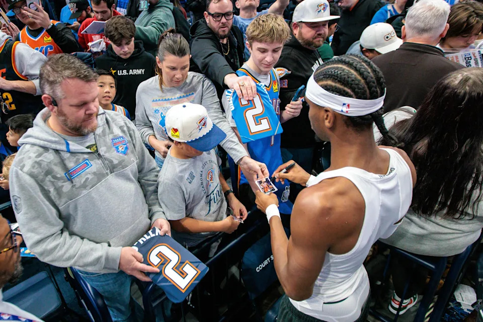 OKLAHOMA CITY, OKLAHOMA - DECEMBER 10: Shai Gilgeous-Alexander #2 of the Oklahoma City Thunder signs autographs prior to the Emirates NBA Cup - Quarterfinals game between the Phoenix Suns and the Oklahoma City Thunder at Paycom Center on December 10, 2025 in Oklahoma City, Oklahoma. NOTE TO USER: User expressly acknowledges and agrees that, by downloading and or using this photograph, User is consenting to the terms and conditions of the Getty Images License Agreement. (Photo by William Purnell/Getty Images)