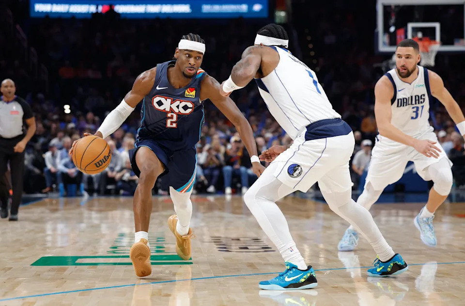 Dec 5, 2025; Oklahoma City, Oklahoma, USA; Oklahoma City Thunder guard Shai Gilgeous-Alexander (2) drives past Dallas Mavericks guard Jaden Hardy (1) during the second half at Paycom Center. Mandatory Credit: Alonzo Adams-Imagn Images