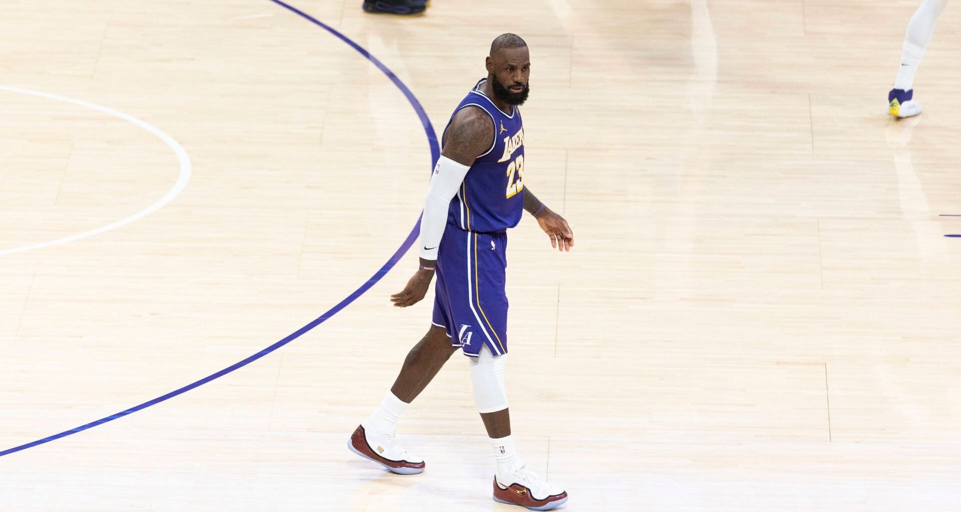 Nov 25, 2025; Los Angeles, California, USA; Los Angeles Lakers guard Luka Doncic (77) and forward LeBron James (23) react after a foul during the first half against the Los Angeles Clippers at Crypto.com Arena
