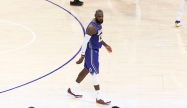Nov 25, 2025; Los Angeles, California, USA; Los Angeles Lakers guard Luka Doncic (77) and forward LeBron James (23) react after a foul during the first half against the Los Angeles Clippers at Crypto.com Arena