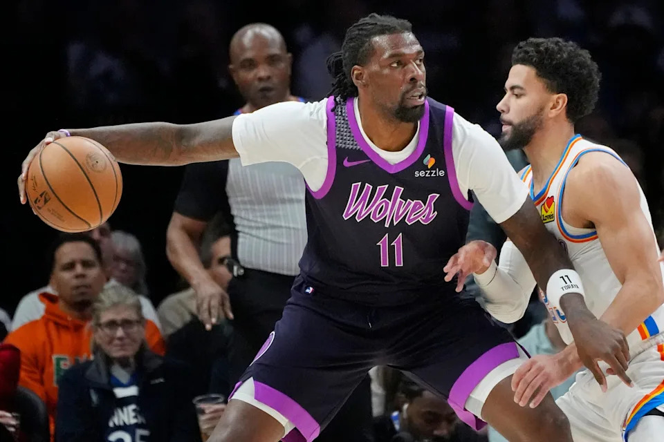 Dec 19, 2025; Minneapolis, Minnesota, USA; Minnesota Timberwolves center Naz Reid (11) works around Oklahoma City Thunder guard Ajay Mitchell (25) in the first quarter at Target Center. Mandatory Credit: Bruce Kluckhohn-Imagn Images