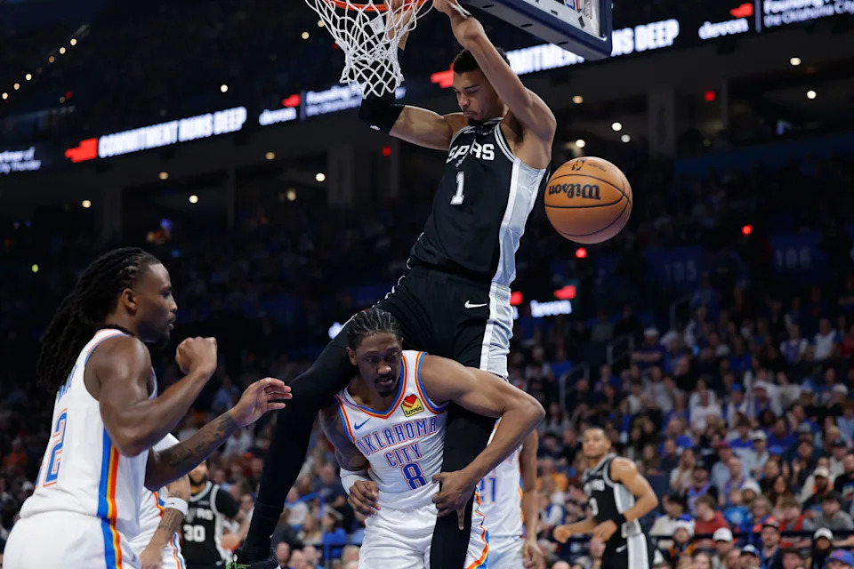 Dec 25, 2025; Oklahoma City, Oklahoma, USA; San Antonio Spurs forward Victor Wembanyama (1) dunks over Oklahoma City Thunder guard Jalen Williams (8) during the second quarter at Paycom Center. Mandatory Credit: Alonzo Adams-Imagn Images