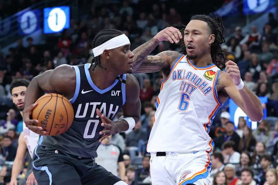Dec 7, 2025; Salt Lake City, Utah, USA; Utah Jazz forward Taylor Hendricks (0) drives against Oklahoma City Thunder forward Jaylin Williams (6) during the second half at Delta Center. Mandatory Credit: Rob Gray-Imagn Images