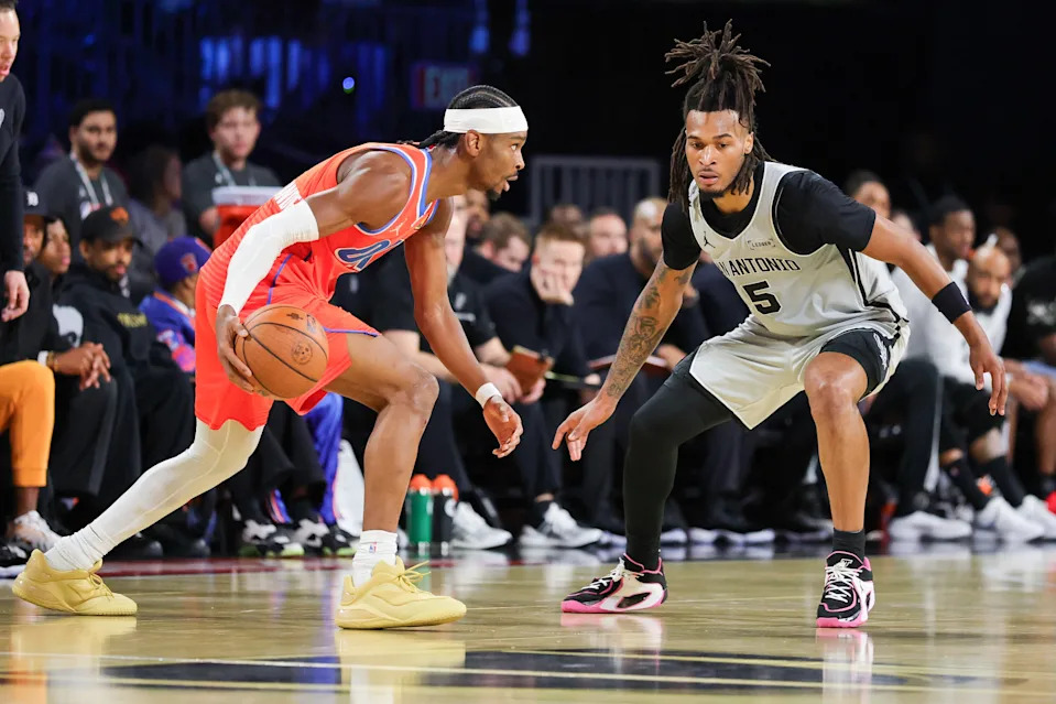 LAS VEGAS, NEVADA - DECEMBER 13: Shai Gilgeous-Alexander #2 of the Oklahoma City Thunder is guarded by Stephon Castle #5 of the San Antonio Spurs in the first quarter of a semifinal game of the Emirates NBA Cup at T-Mobile Arena on December 13, 2025 in Las Vegas, Nevada.
