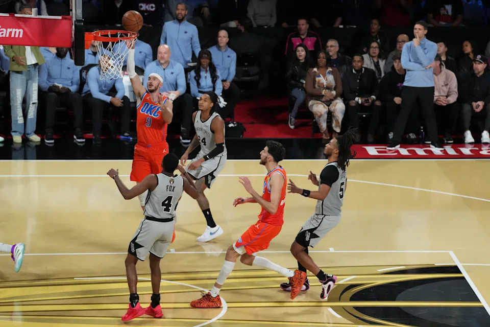Dec 13, 2025; Las Vegas, Nevada, USA; Oklahoma City Thunder guard Alex Caruso (9) shoots the ball against the San Antonio Spurs during the second half at T-Mobile Arena. Mandatory Credit: Kirby Lee-Imagn Images