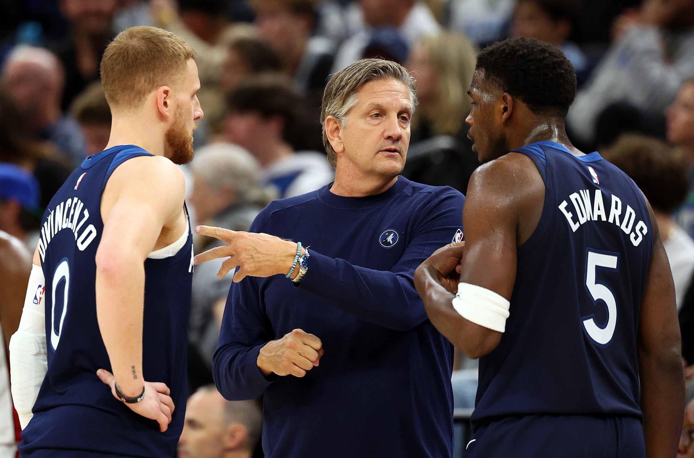 MINNEAPOLIS, MINNESOTA - NOVEMBER 10: Head coach Chris Finch (C) talks to Anthony Edwards #5 and Donte DiVincenzo #0 of the Minnesota Timberwolves in the third quarter against the Miami Heat at Target Center on November 10, 2024 in Minneapolis, Minnesota. The Heat defeated the Timberwolves 95-94. NOTE TO USER: User expressly acknowledges and agrees that, by downloading and or using this photograph, User is consenting to the terms and conditions of the Getty Images License Agreement. (Photo by David Berding/Getty Images)