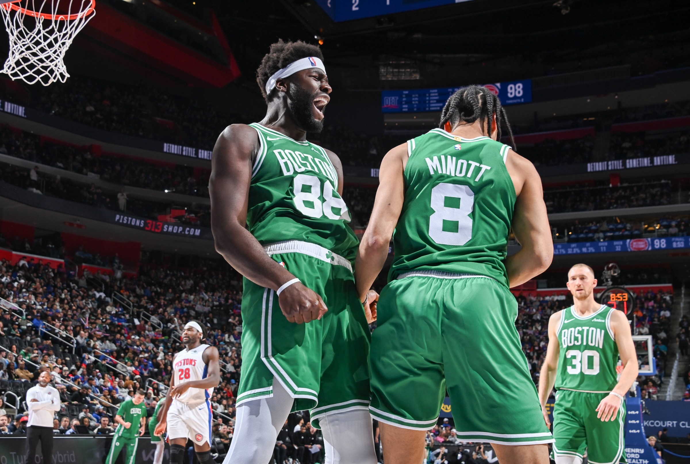 DETROIT, MI - OCTOBER 26: Neemias Queta #88 and Josh Minott #8 of the Boston Celtics celebrate during the game against the Detroit Pistons on October 26, 2025 at Little Caesars Arena in Detroit, Michigan. NOTE TO USER: User expressly acknowledges and agrees that, by downloading and/or using this photograph, User is consenting to the terms and conditions of the Getty Images License Agreement. Mandatory Copyright Notice: Copyright 2025 NBAE (Photo by Chris Schwegler/NBAE via Getty Images)