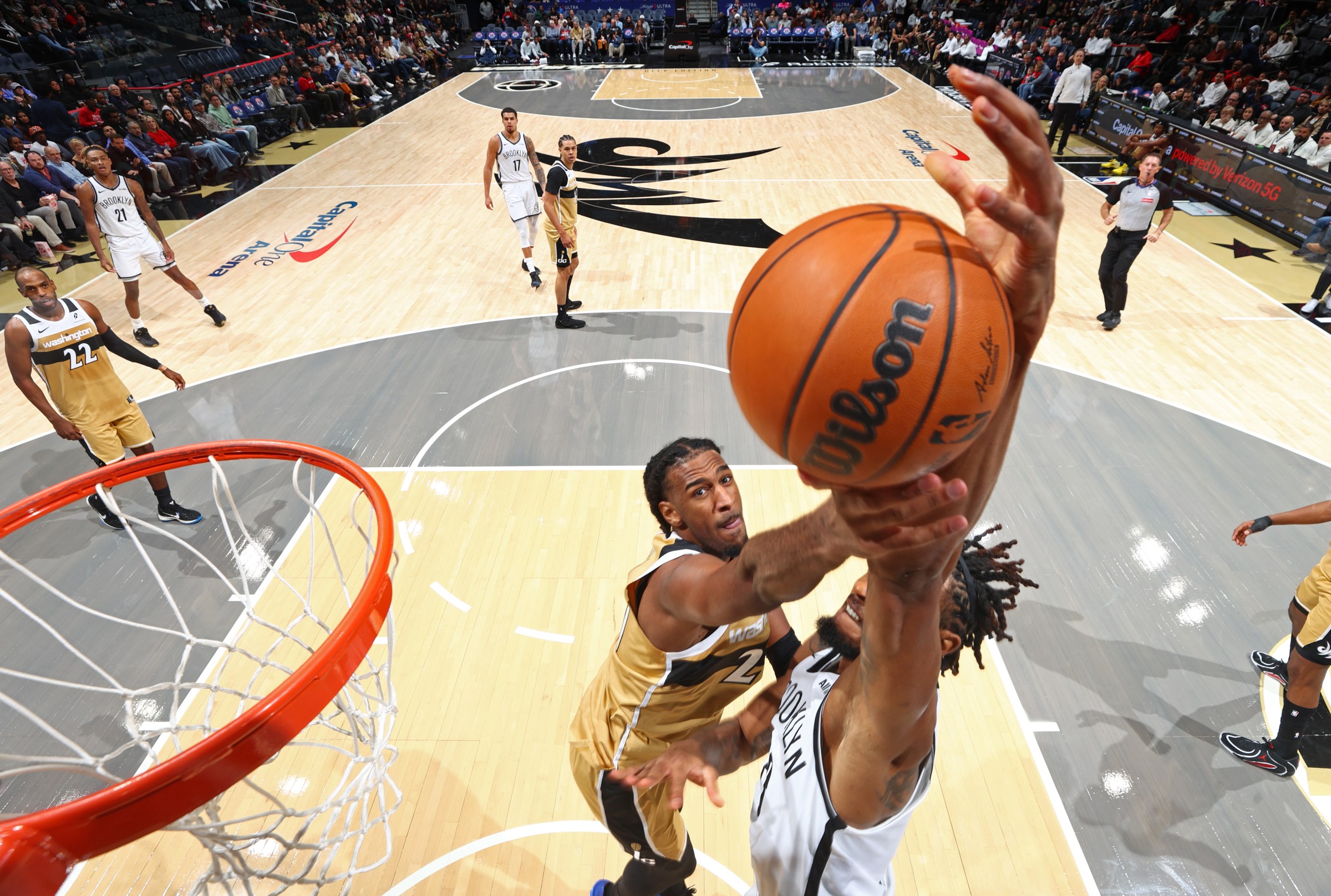 Wizards big man Alex Sarr protecting the rim with a block.