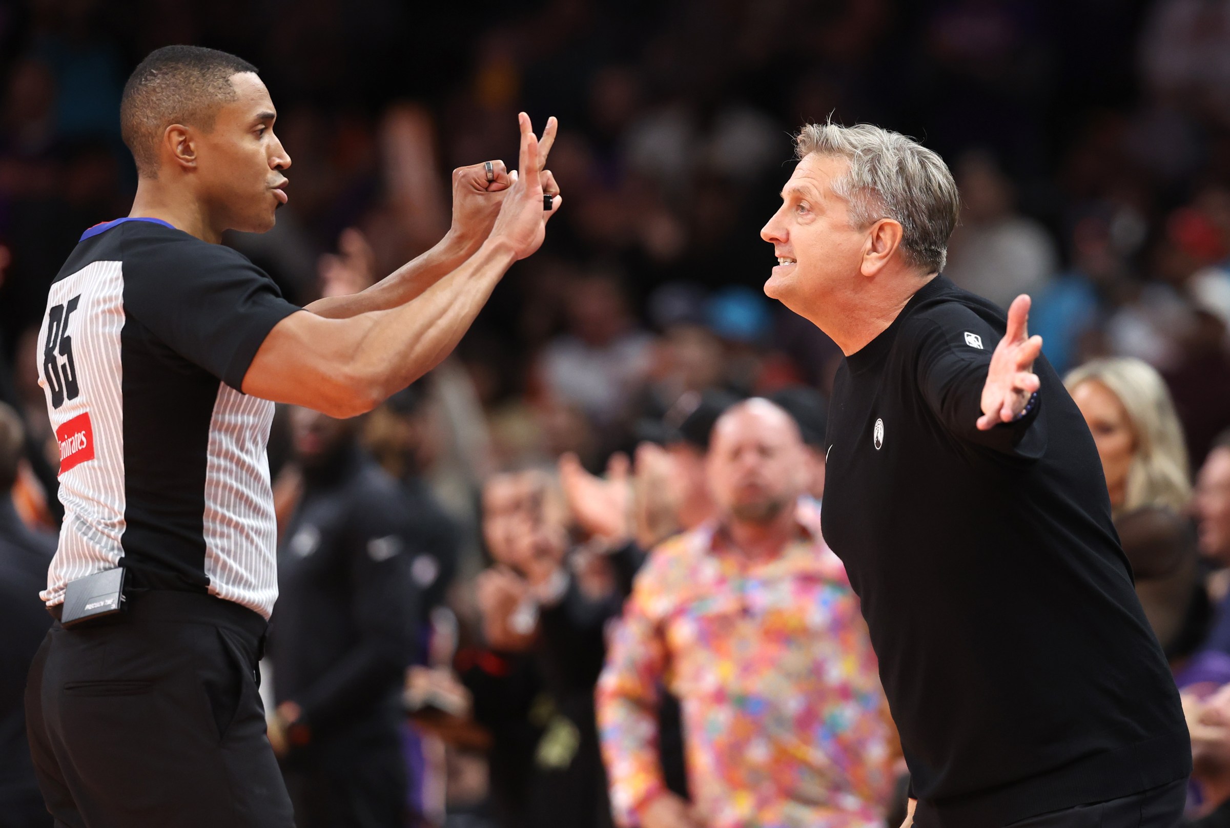 PHOENIX, ARIZONA - NOVEMBER 21: Head coach Chris Finch of the Minnesota Timberwolves reacts as referee Robert Hussey #85 calls a foul on Julius Randle #30 during the second half of an NBA Cup game against the Phoenix Suns at Mortgage Matchup Center on November 21, 2025 in Phoenix, Arizona. NOTE TO USER: User expressly acknowledges and agrees that, by downloading and or using this photograph, User is consenting to the terms and conditions of the Getty Images License Agreement. (Photo by Chris Coduto/Getty Images)