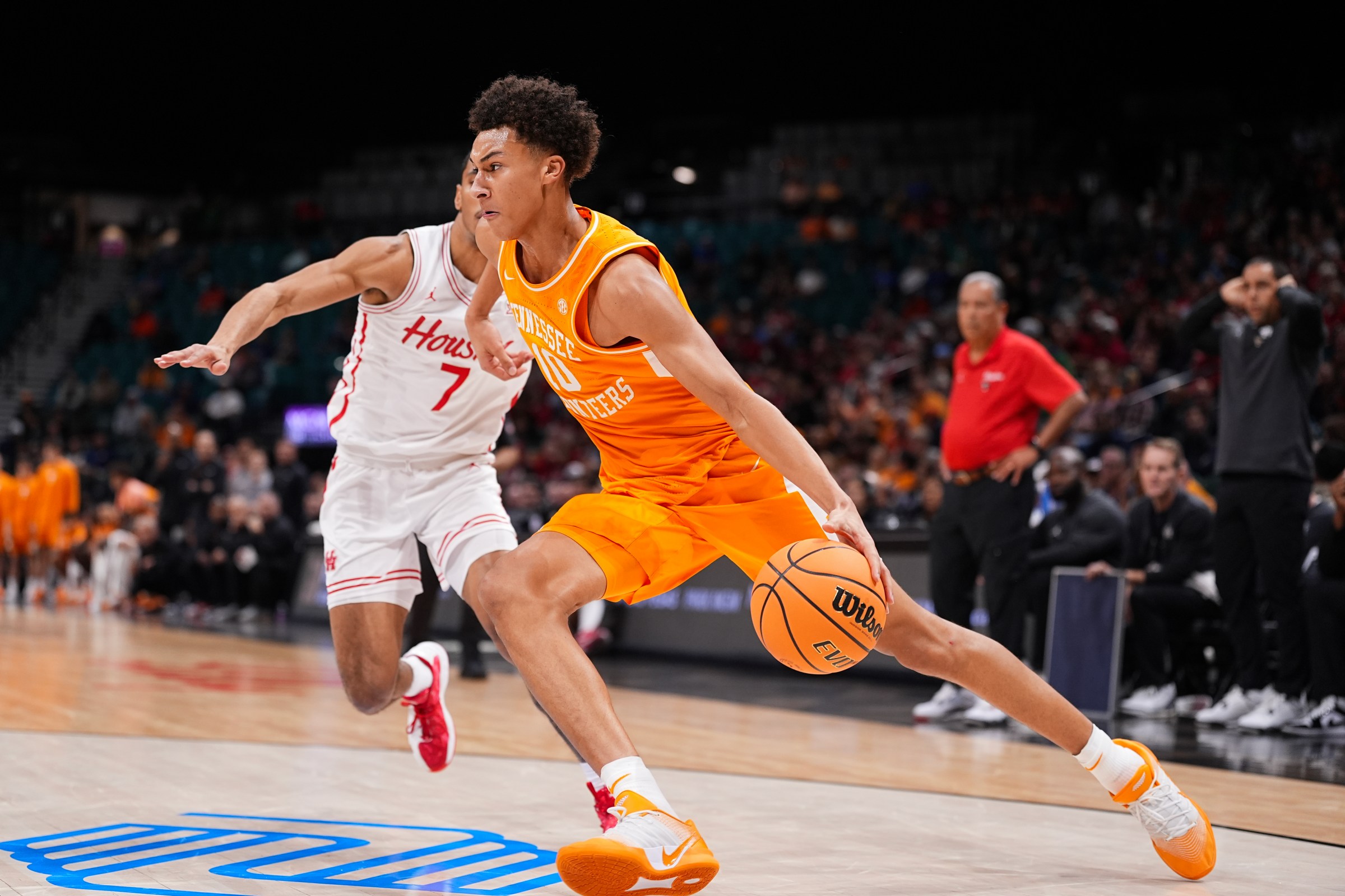 LAS VEGAS, NEVADA - NOVEMBER 25: Nate Ament #10 of the Tennessee Volunteers drives to the basket against Milos Uzan #7 of the Houston Cougars in the first half during the Players Era Championship basketball tournament at MGM Grand Garden Arena on November 25, 2025 in Las Vegas, Nevada. (Photo by Zach Del Bello/Players Era/Getty Images)