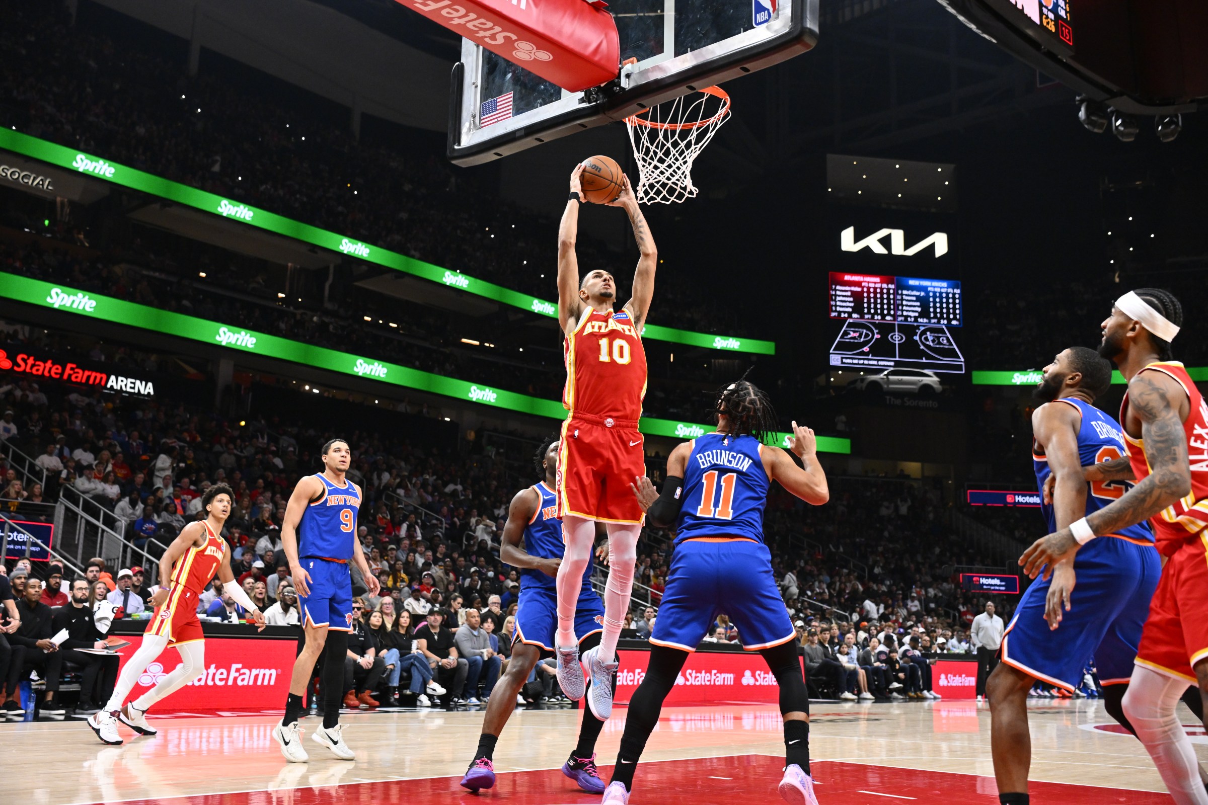 ATLANTA, GA - DECEMBER 27: Zaccharie Risacher #10 of the Atlanta Hawks dunks the ball during the game against the New York Knicks on December 27, 2025 at State Farm Arena in Atlanta, Georgia. NOTE TO USER: User expressly acknowledges and agrees that, by downloading and/or using this Photograph, user is consenting to the terms and conditions of the Getty Images License Agreement. Mandatory Copyright Notice: Copyright 2025 NBAE (Photo by Adam Hagy/NBAE via Getty Images)