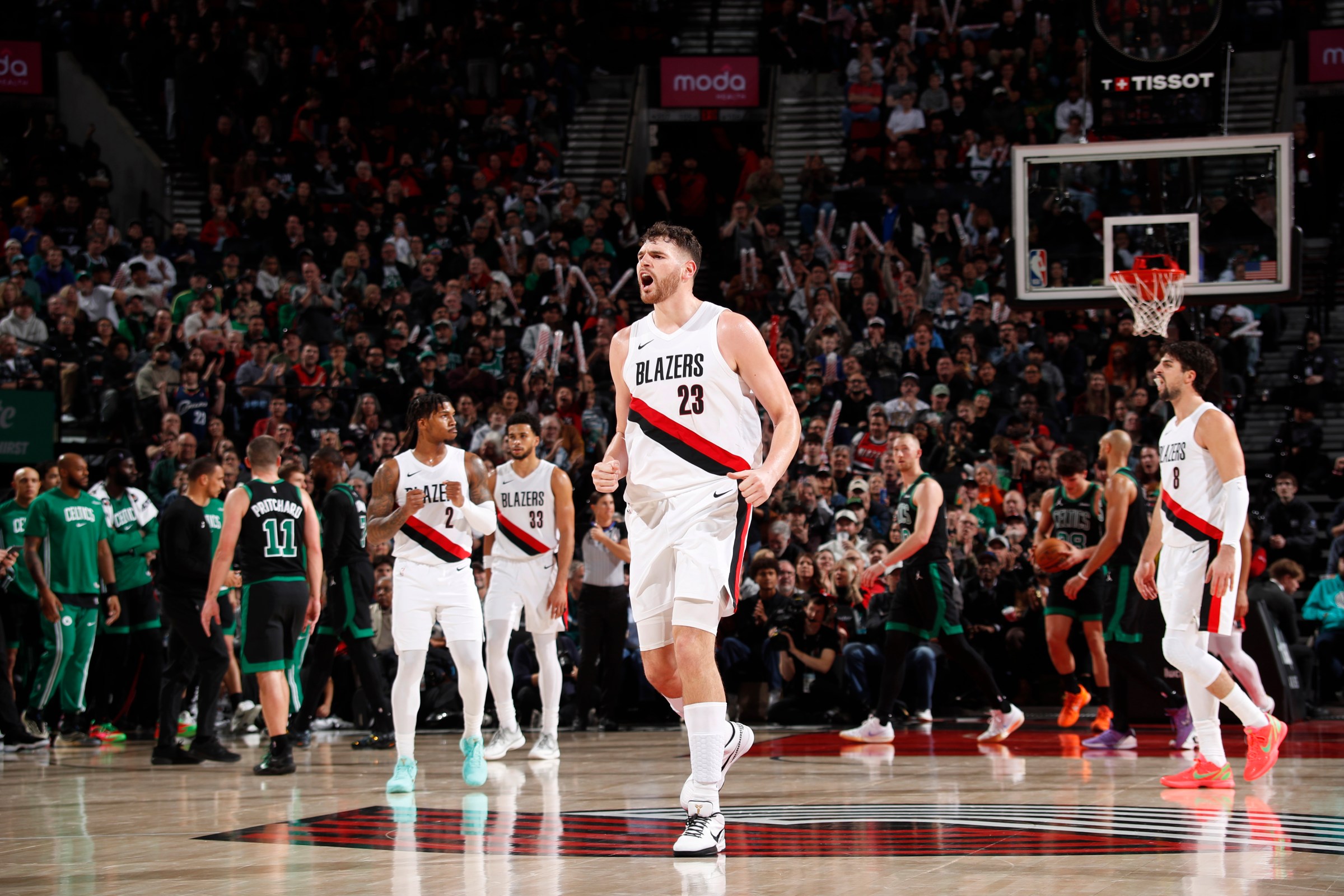 PORTLAND, OR - DECEMBER 28: Donovan Clingan #23 of the Portland Trail Blazers celebrates during the game against the Boston Celtics on December 28, 2025 at the Moda Center Arena in Portland, Oregon. NOTE TO USER: User expressly acknowledges and agrees that, by downloading and or using this photograph, user is consenting to the terms and conditions of the Getty Images License Agreement. Mandatory Copyright Notice: Copyright 2025 NBAE (Photo by Cameron Browne/NBAE via Getty Images)