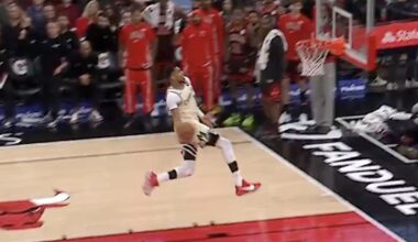 Bucks star Giannis Antetokounmpo going up for a windmill dunk