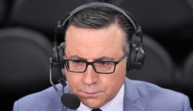 Ian Eagle wearing a headset