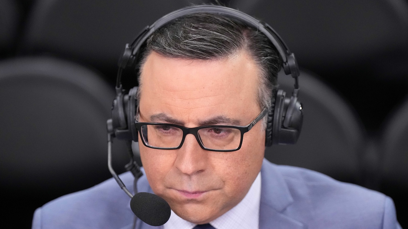 Ian Eagle wearing a headset