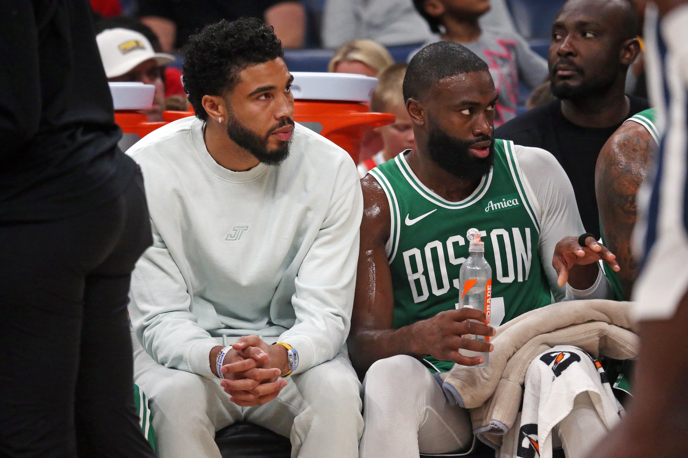 Oct 8, 2025; Memphis, Tennessee, USA; Boston Celtics forward Jayson Tatum (0) and guard Jaylen Brown (7) look on from the bench during the second quarter against the Memphis Grizzlies at FedExForum. Mandatory Credit: Petre Thomas-Imagn Images
