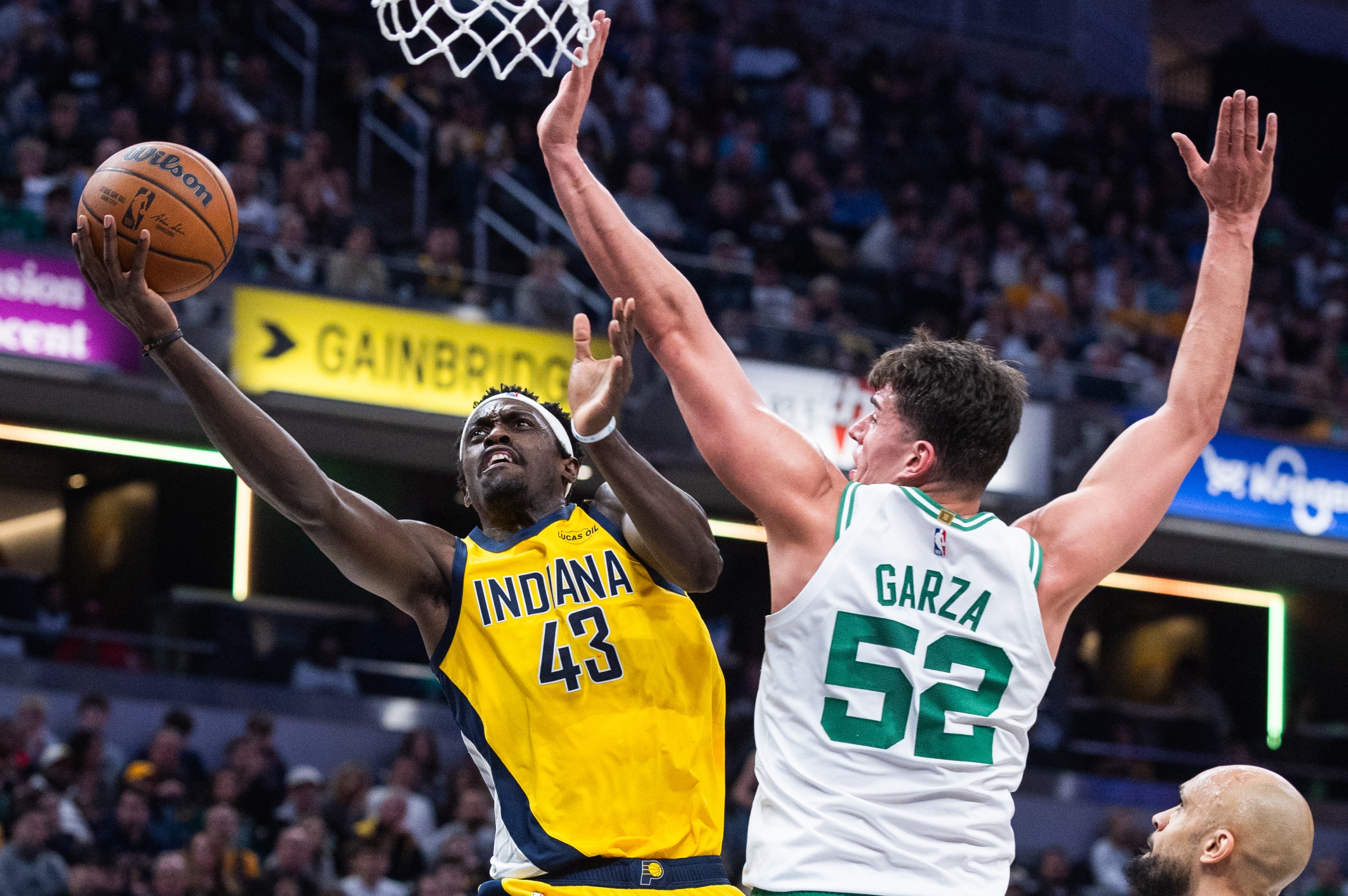 Dec 26, 2025; Indianapolis, Indiana, USA; Indiana Pacers forward Pascal Siakam (43) shoots the ball while Boston Celtics center Luka Garza (52) defends in the first half at Gainbridge Fieldhouse. Mandatory Credit: Trevor Ruszkowski-Imagn Images