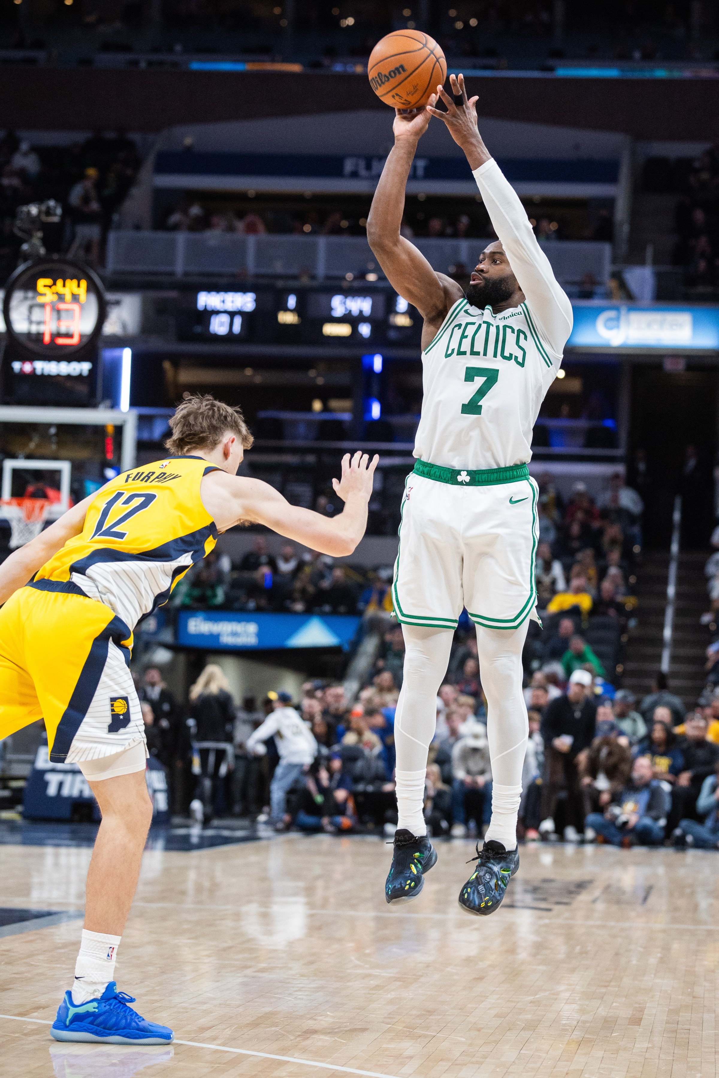 Dec 26, 2025; Indianapolis, Indiana, USA; Boston Celtics guard/forward Jaylen Brown (7) shoots the ball while Indiana Pacers guard Johnny Furphy (12) defends in the second half at Gainbridge Fieldhouse. Mandatory Credit: Trevor Ruszkowski-Imagn Images