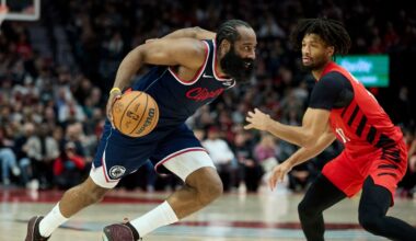 Los Angeles Clippers guard James Harden, left, dribbles past Portland Trail Blazers guard Shaedon Sharpe during the second half of an NBA basketball game in Portland, Ore., Friday, Dec. 26, 2025. (AP Photo/Craig Mitchelldyer)